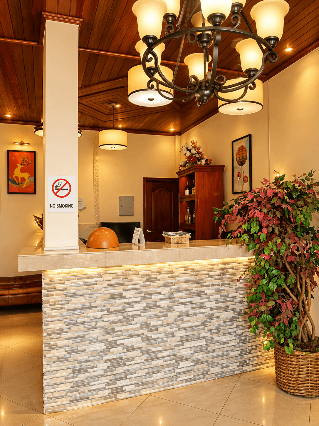 Reception hall with marble-effect floor and a stone-fronted front desk